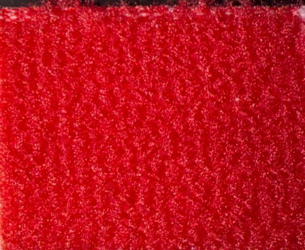 Detalle de textura de moqueta Timelediss tipo rizo en tono morado púrpura vibrante