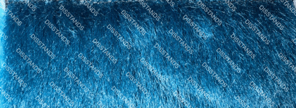 Detalle de textura de moqueta tipo pelo en tono beige caramelo con acabado suave y denso