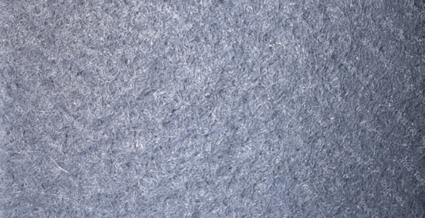 Detalle de textura de moqueta Pigalldis tipo rizo con fibras compactas en tono gris oscuro